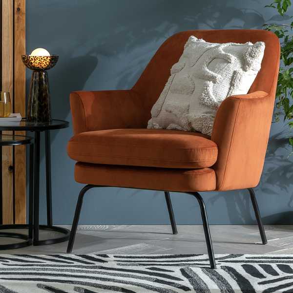 An orange accent chair.